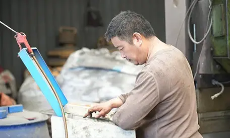 Chenma worker processing pump part